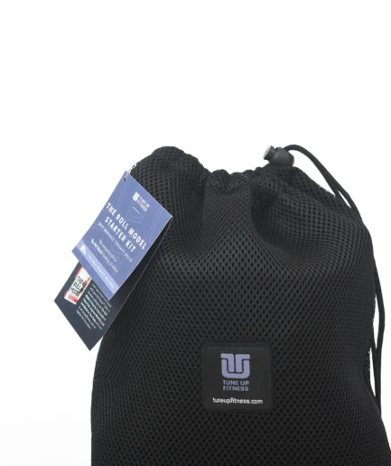 A black mesh drawstring bag for "The Roll Model Starter Kit" by Tune Up Fitness