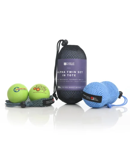 A collection of three different Yoga Tune Up therapy ball sets: a small green pair, a large ALPHA Twin Ball set, and a medium blue pair