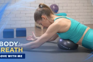 A woman is shown performing a yoga or Pilates exercise, likely a back stretch or strengthening movement.