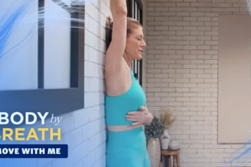 A woman participating in a fitness or yoga session.