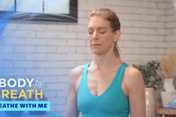 The woman is positioned in a manner that suggests she is practicing a form of mindfulness or yoga.