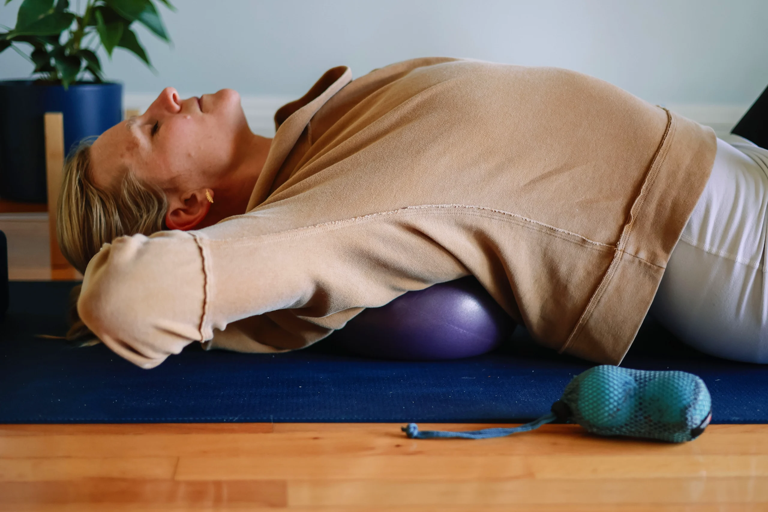 Sarah Harmon performs self massage SMFR with Coregeous on spine
