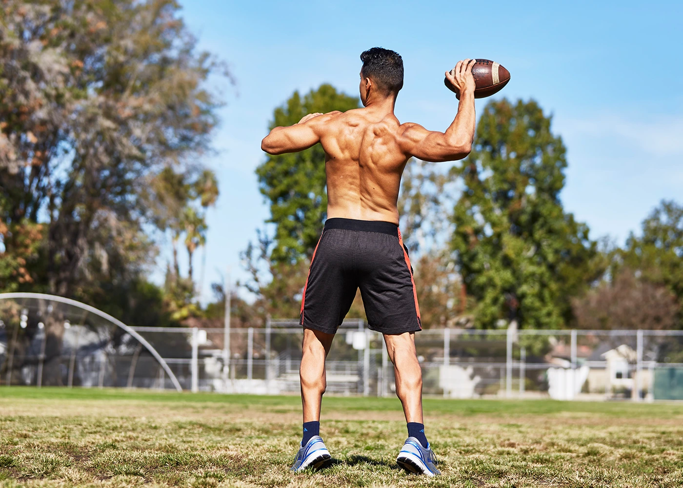 Performance_Section_Lifestyle_New_to_TUF A man practicing throwing a football.